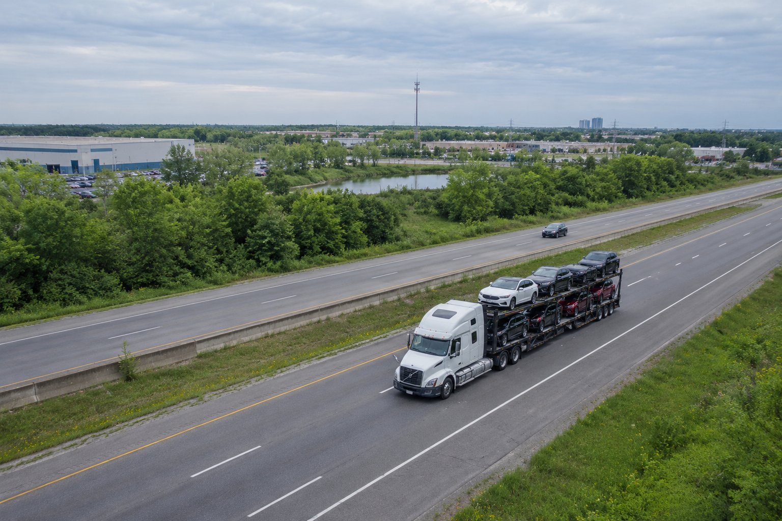 Car hauler truck transporting vehicles on a Canadian highway