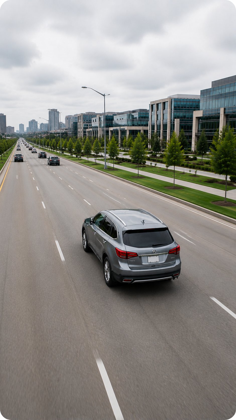 Silver SUV being driven down a Canadian city boulevard
